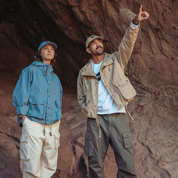 Models wearing the Cnaoe Club x Engineered Garments collection outdoors in Colorado