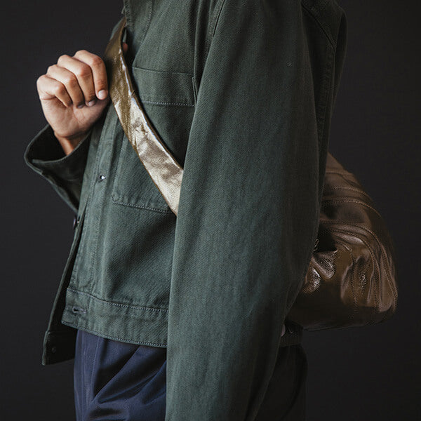 Lemaire Look Closeup of Green Jacket and Brown Bag